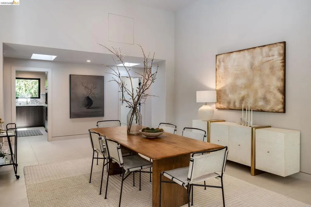 Spacious dining area featuring high ceilings, recessed lighting, and skylights