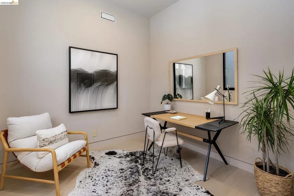 Room featuring light wood-finish flooring, neutral wall tones, and recessed ceiling HVAC