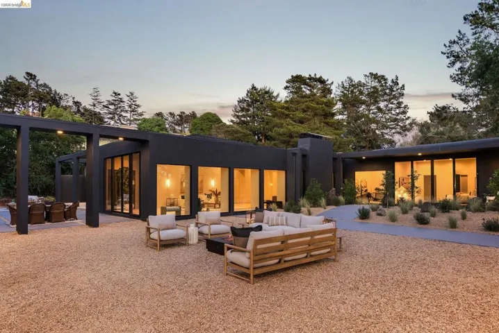 Modern exterior with dark-toned siding and extensive glass panels