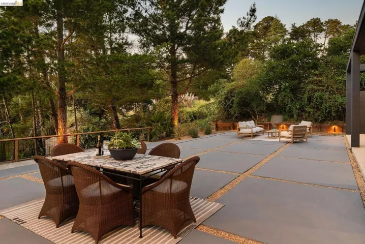 Expansive outdoor patio featuring large-format pavers with gravel​​‌​​​​‌​​‌‌​​‌​​​‌‌​​​‌​​‌‌​​‌‌​​‌‌​​​​ joints