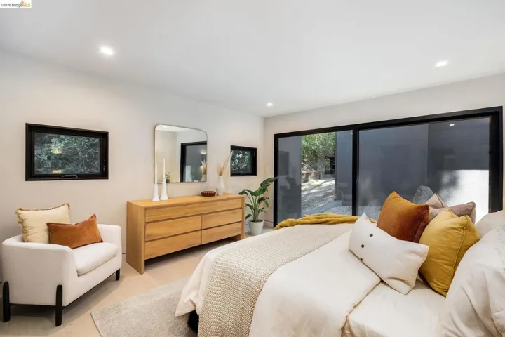 Bedroom featuring wide plank flooring, recessed lighting, and a full wall of sliding glass doors opening to the exterior