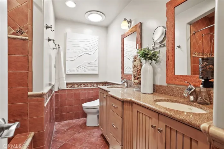 Guest bath with double sinks and soaking tub.