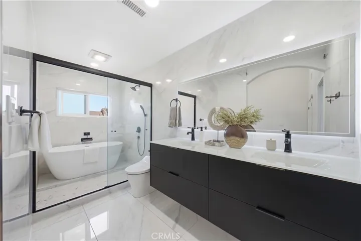 Primary bedroom with upgraded bathroom and walk-in closet