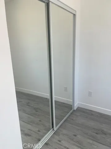 Mirrored wardrobes in bedroom.