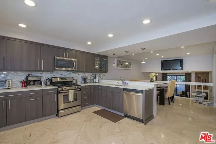 kitchen opens to dining
