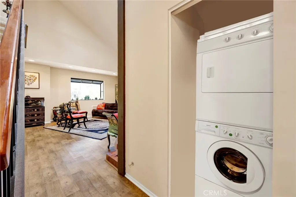 Convenient in-unit laundry area with stacked washer and dryer near the living space.