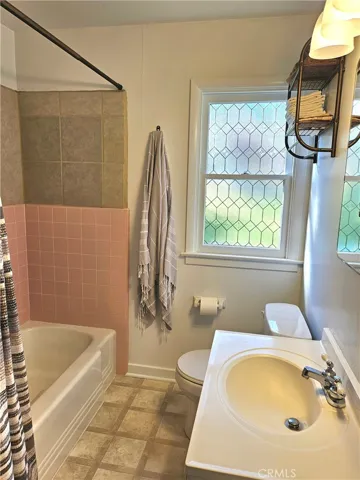Main Bathroom. New window. Tub and Shower.