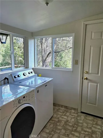 Laundry room. Again really good views and good lighting. Door goes to deck.
