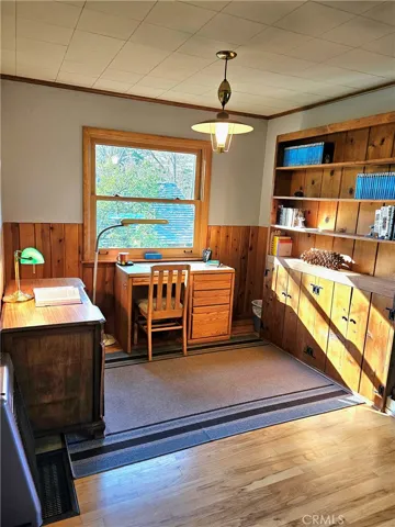  Office area, view of yard. Hardwood flooring/ carpet.