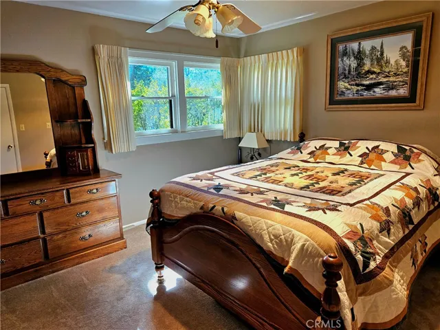 Master Bedroom # 1. Carpet, great view of landscaped front yard.
