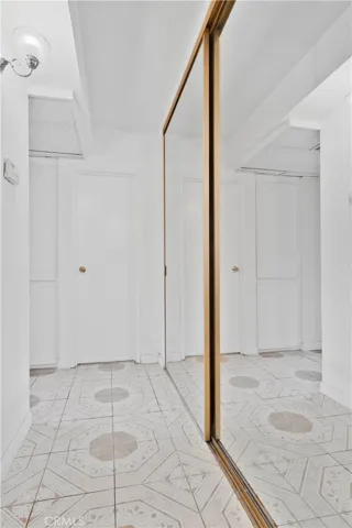 Hallway with Floor-Ceiling Mirrored Closet