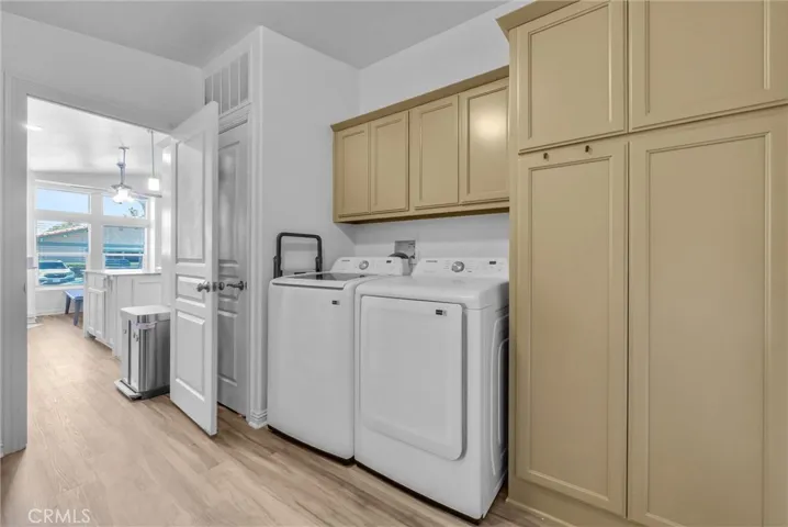 laundry room with plenty of storage