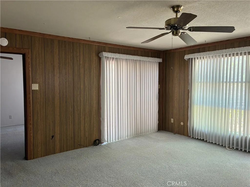Enormous master bedroom with slider to the patio and gardens.