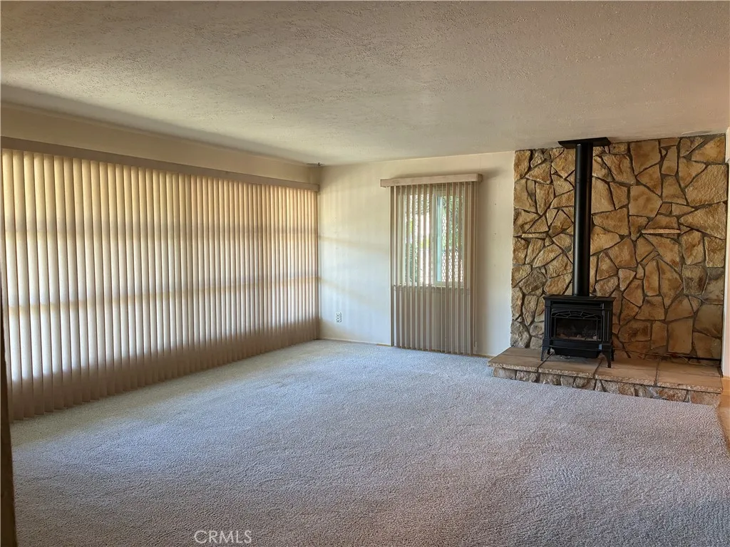 This full wall of windows allows the sunshine to light up this room!!!