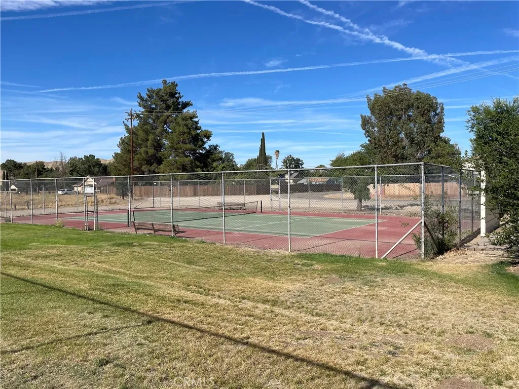 Tennis at the park nearby community park.