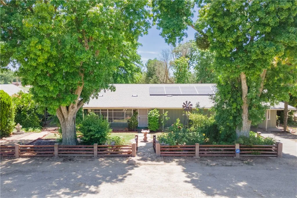 Exquisite gardens surround this lovely family home!