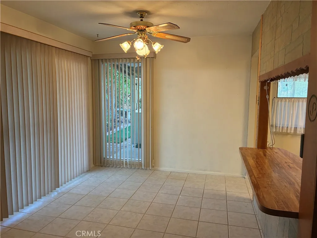 lDining area opens to the covered patio area. With Bar pass through from the kitchen.