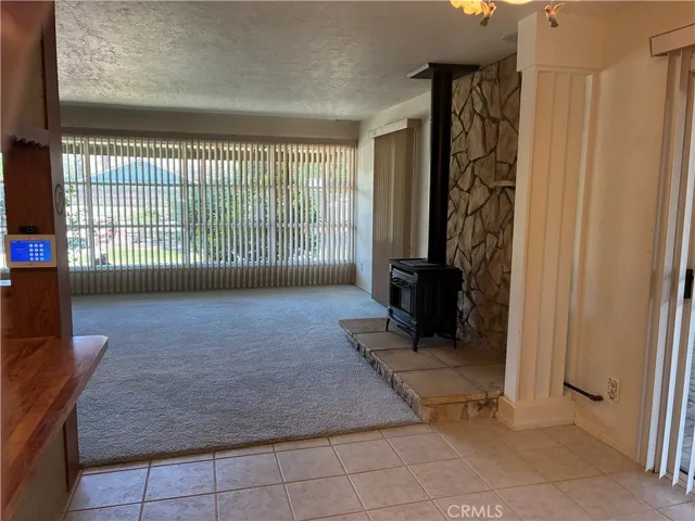 Living room is spacious! Stove for heat and ambiance!  Surround sound for movie night or games and those stunning views!!!