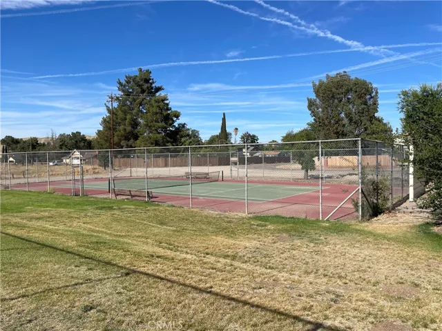 Tennis at the park nearby community park.