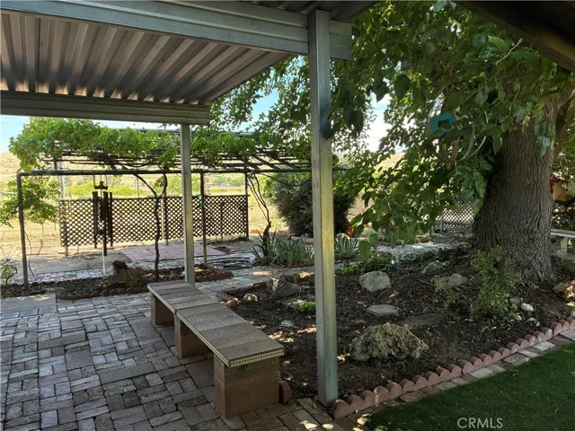 Everyone will want to gather on this covered patio for summer get togethers and BBQs