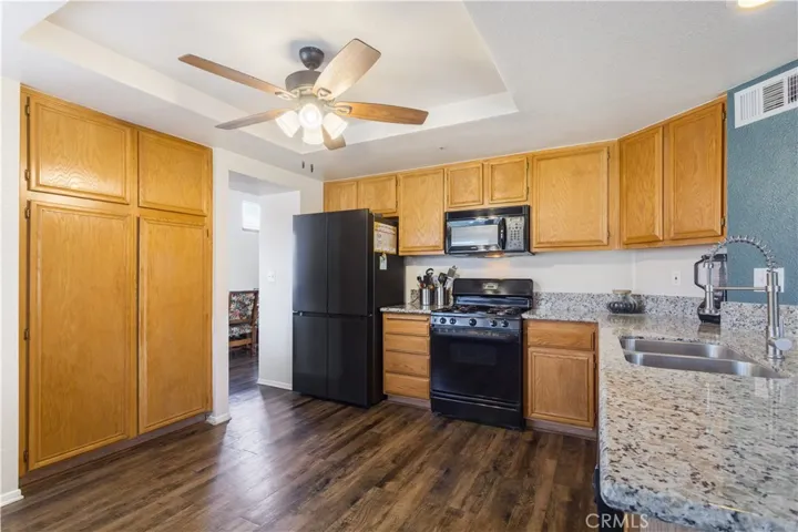 Currently kitchen has No teal paint and new appliances