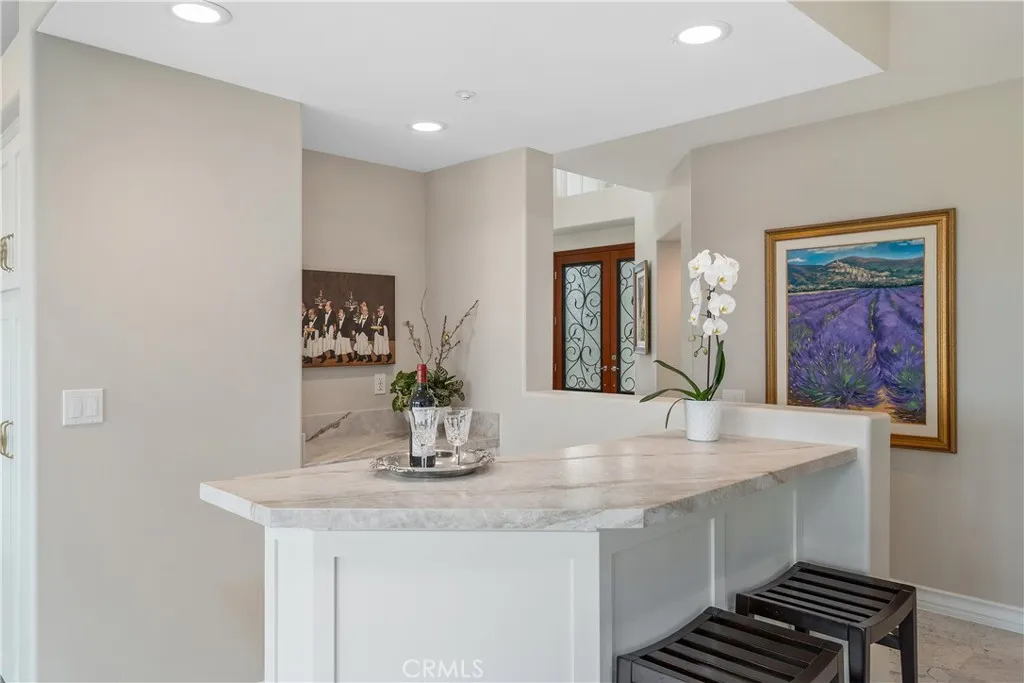 Spacious family room featuring direct access to the backyard swimming pool and scenic views.