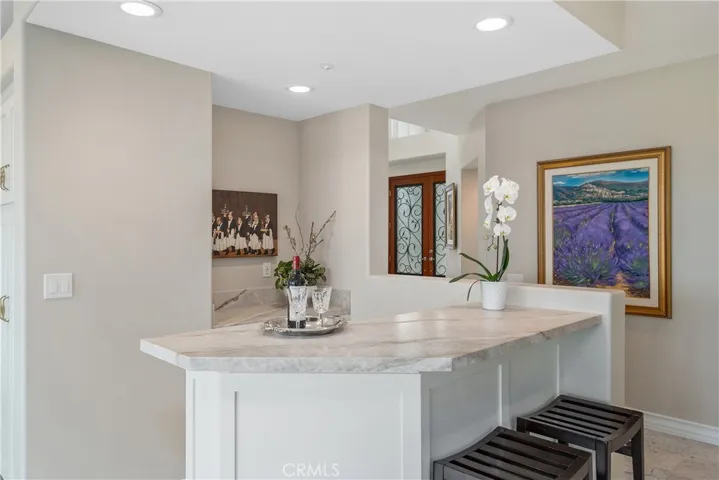 Spacious family room featuring direct access to the backyard swimming pool and scenic views.