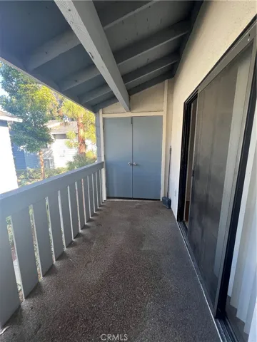 Balcony - double doors entrance to laundry closet.