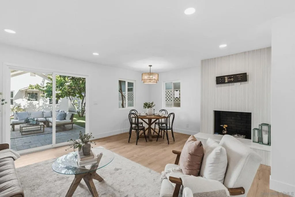 New vinyl slider with back yard access, tiled fireplace that was just tiled and with a 55 inch TV installed.  Beautiful light and space in this room!