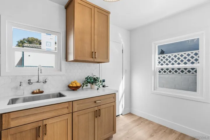 ADU Kitchen features brand new cabinets, counters  and fixtures, tankless water heater. All appliances convey to the buyer!