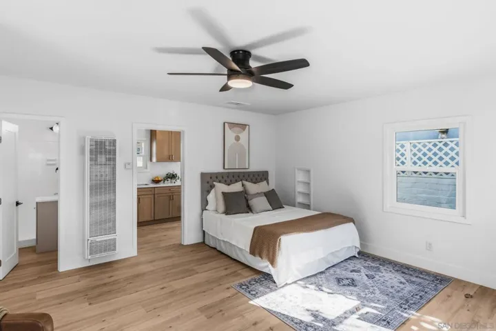 ADU Bedroom is shared with a perfectly-sized living room.  432 estimated square feet with a brand new kitchen, tankless water heater, luxury vinyl plank flooring and a parking spot.