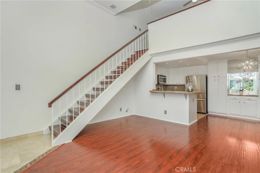 Living Room, Dining room and kitchen with stairs to the loft.