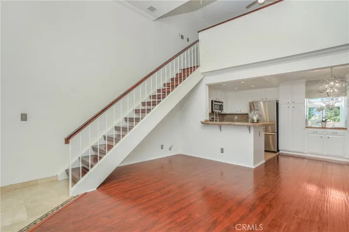 Living Room, Dining room and kitchen with stairs to the loft.
