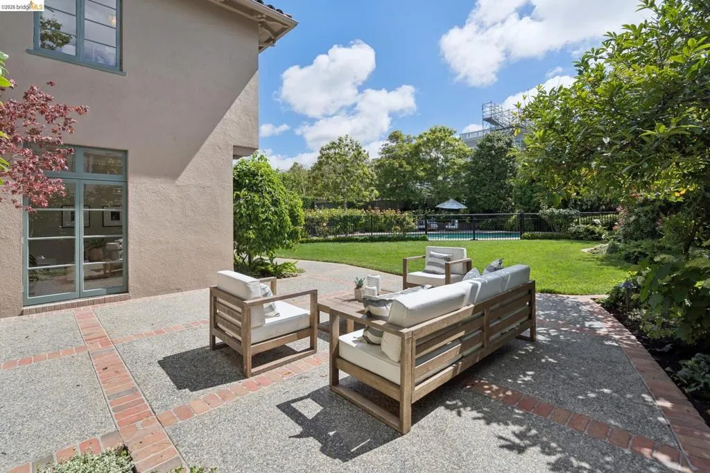 Living room, den or office and breakfast nook all open to the rear gardens, patios and pool