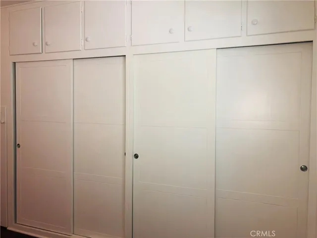Second bedroom has wall-to-wall closets and storage.