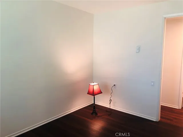 (Some photos of prior time listed) Second of two bedrooms with new low-maintenance woodlike flooring, new paint and all new switches throughout.