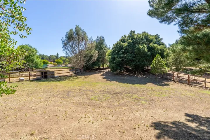 At the back part of the ~1.17 acre property is a wide open space. Walk to school with ease through the gate located in the back corner of the property.
