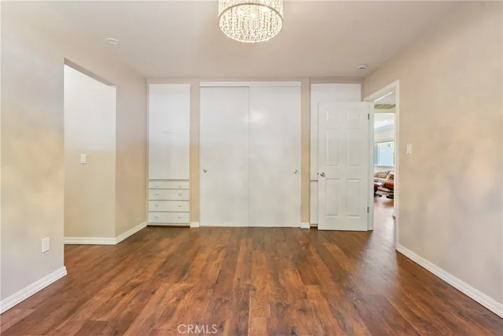 The bedroom has a good sized closed plus built-in cabinets on either side.