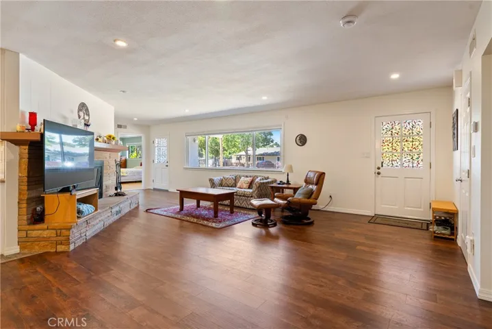 Stepping inside you are greeted by newer engineered hardwood floors that flow throughout most of the home.