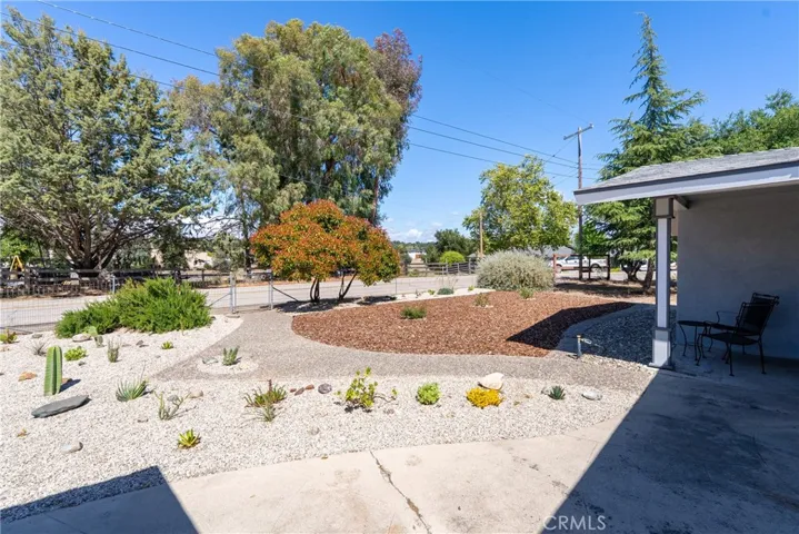 Walking up to the front door you will admire the low maintenance landscaped yard which adds some nice curb appeal.