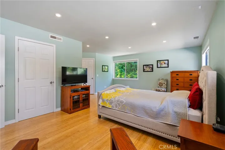 The primary bedrooms has a walk-in closet with closet organizers. The closet is the back right door.