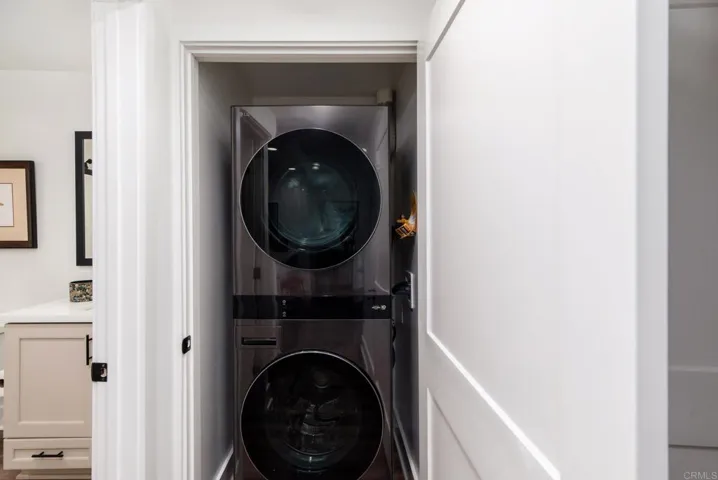 Convenient full size stackable laundry closet with gas or electric hook-ups.