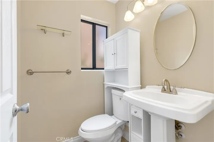 Downstairs Secondary Bathroom - Located close to the Front Door of the Unit.