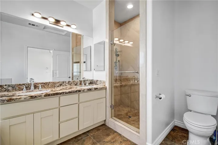 Primary bathroom with walk-in shower.