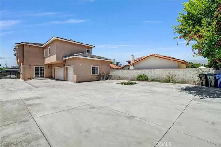 Expansive backyard with ample parking and ADU potential.