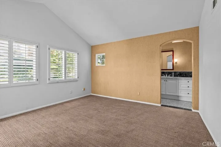 View into primary suite and primary bathroom