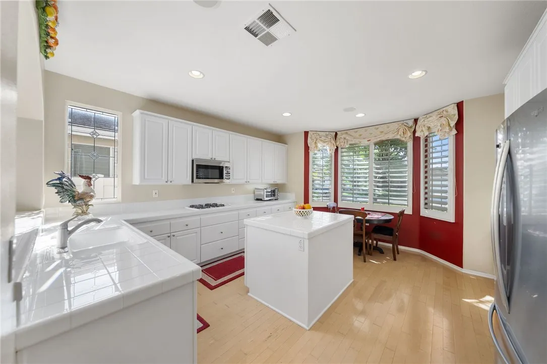 Kitchen with island an small breakfast area