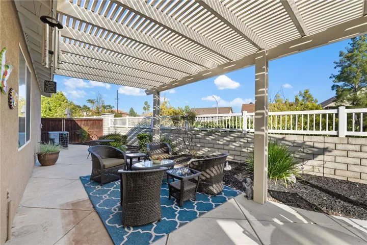 Another view of backyard patio with lots of seating options