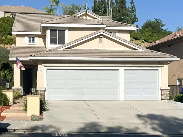 Front with 3 car garage