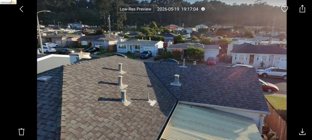 Asphalt shingle roof with multiple ventilation pipes